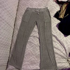 Y2K low rise flared grey and teal leggings.